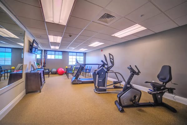 Interior view of a fitness room with exercise equipment