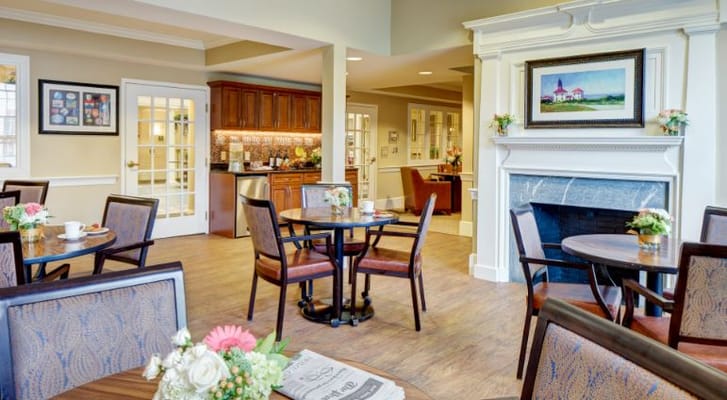 A bright common area with tables and chairs