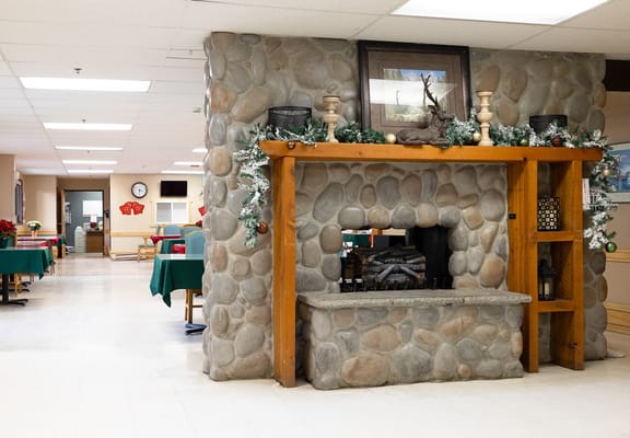 Cozy dining area with a stone fireplace