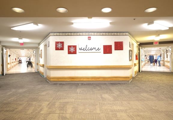 Interior hallway with welcome sign and artwork