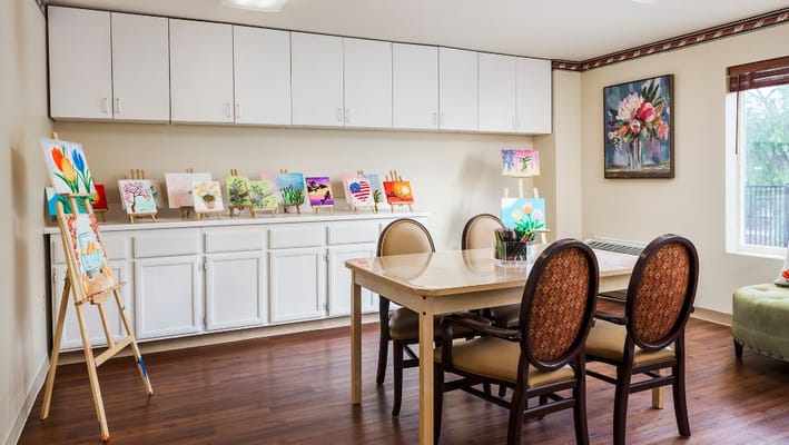 Activity room with art pieces displayed on easels