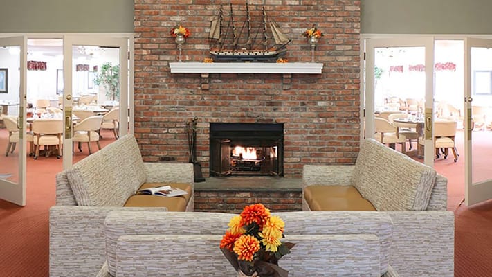 Cozy common area with a fireplace and seating