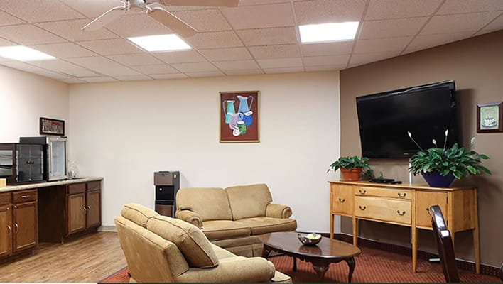 Common area with seating and television