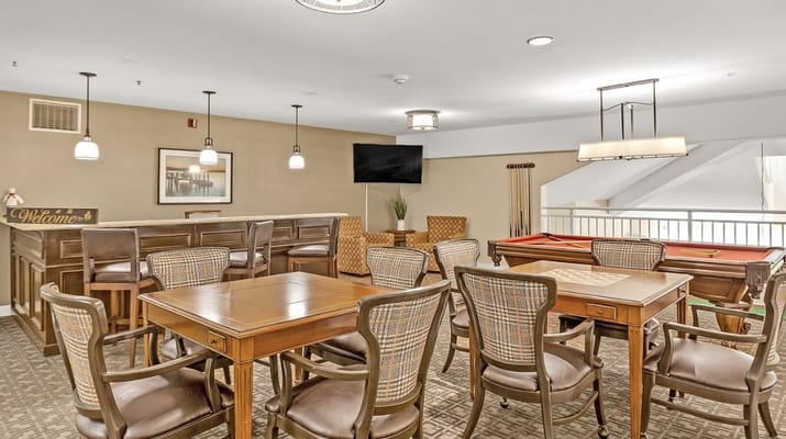 Interior common area with seating and game tables