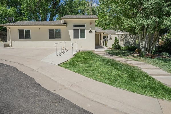 Exterior view of the facility with walkways and greenery