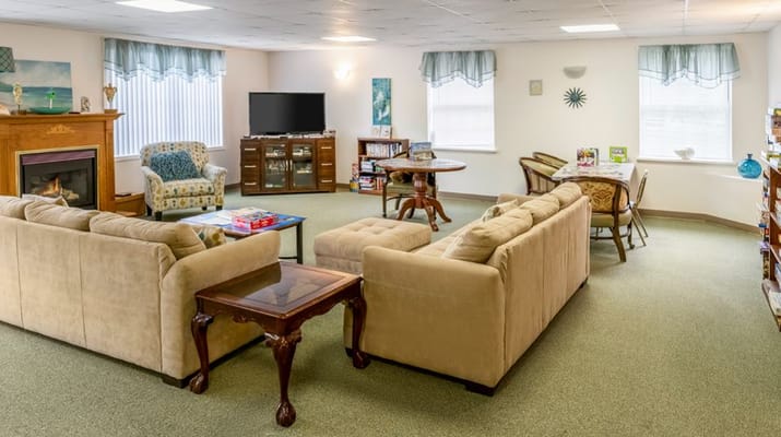 Spacious living room with comfortable seating and a television