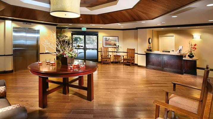 Bright and welcoming lobby with wooden accents and seating