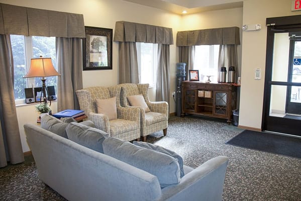 Cozy lounge area with seating and natural light