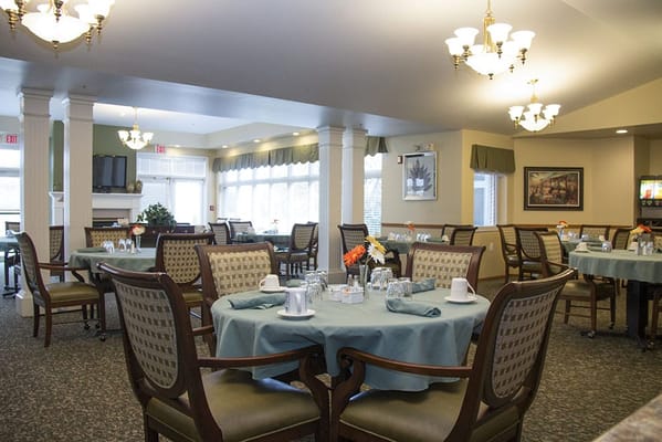 Dining area with tables set for meal service