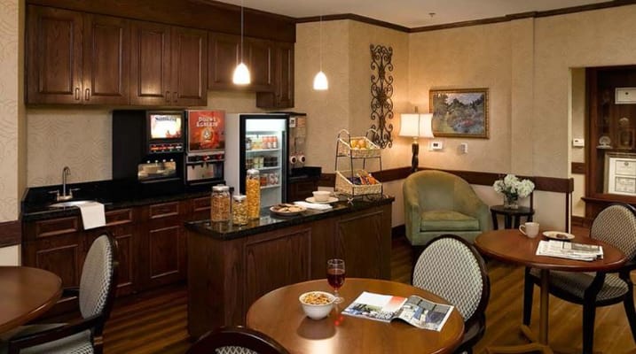 Interior view of a cozy common area with food options