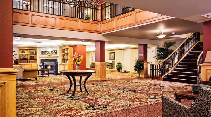 Lobby area with a staircase and seating