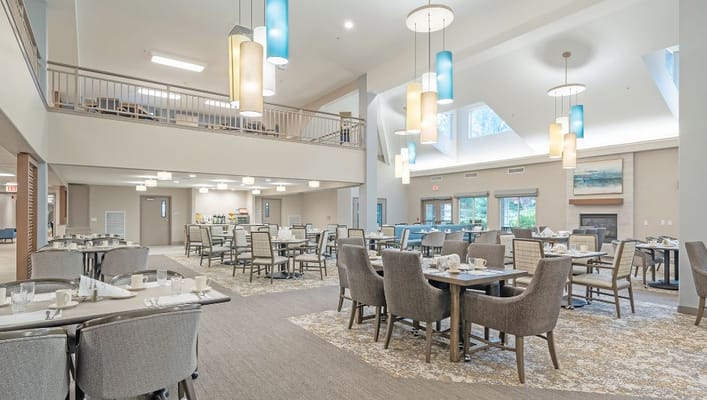 Dining area setup for residents with tables and chairs