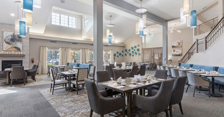 Bright and spacious dining area with tables and colorful decor