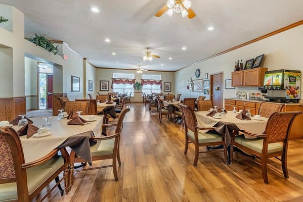 Interior view of a dining room with tables and chairs