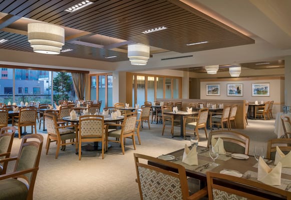 Elegant dining room with tables set for a meal