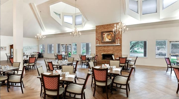 Bright dining room with tables and chairs arranged