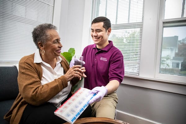 Caregiver assisting resident with medications