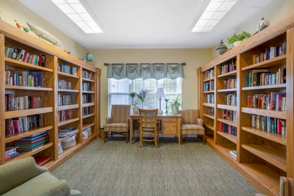 Cozy reading nook with bookshelves and seating
