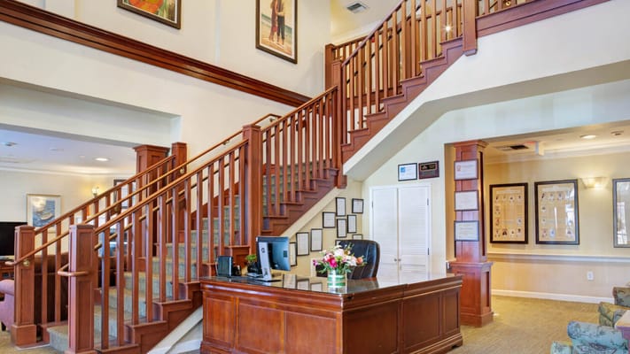 Interior view of a reception area with a staircase