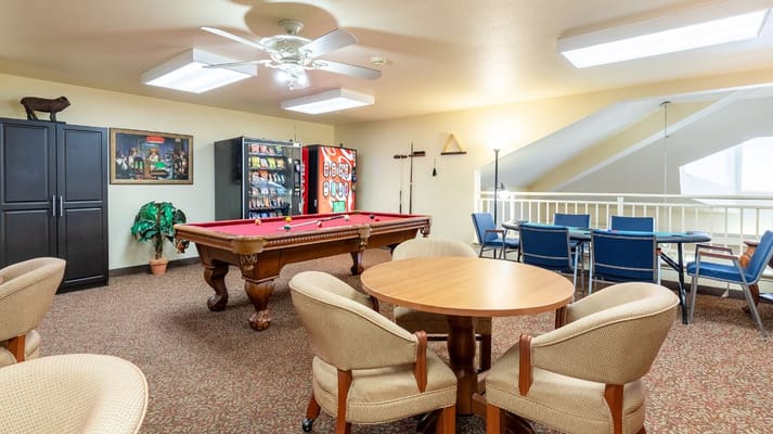 Game room with pool table and seating area