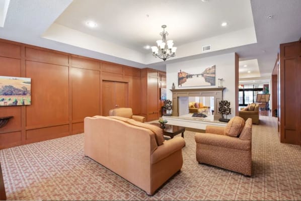 Bright common area with comfortable seating and artwork