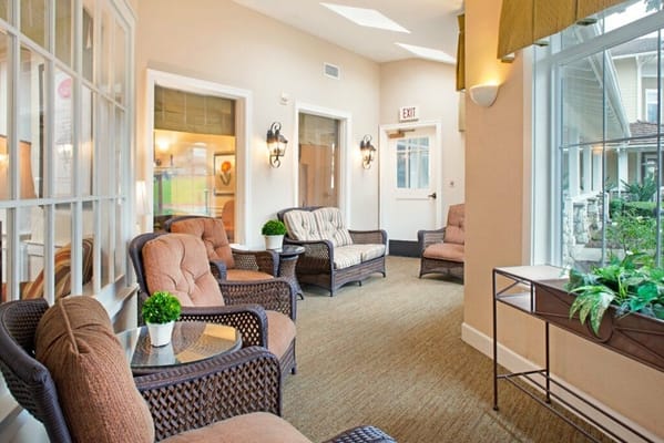 A cozy common area with comfortable seating and plants