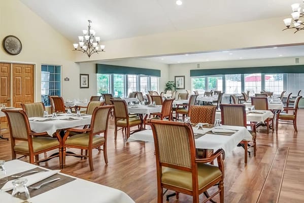 Bright dining room with wooden tables and chairs