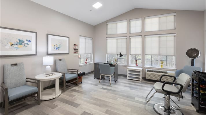Interior of the hair salon with seating and natural light