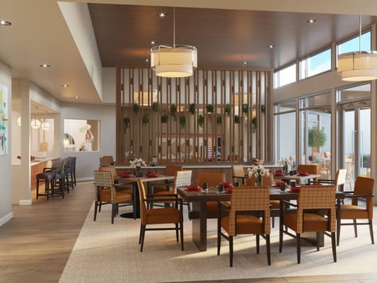 Bright dining area with tables set for residents