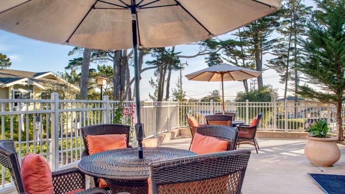 Outdoor seating area with umbrellas and chairs