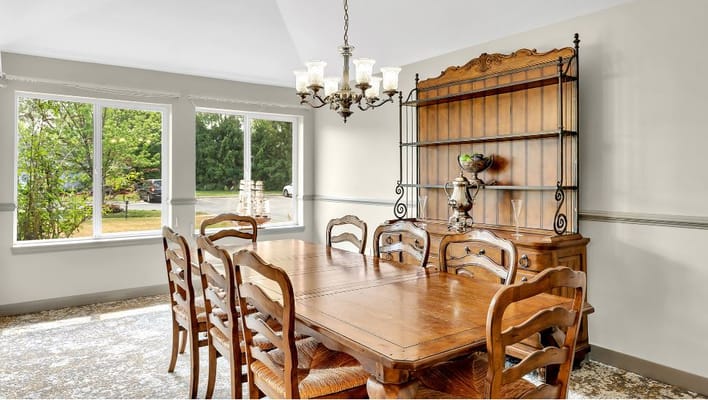 Cozy dining room with wooden table and chandelier