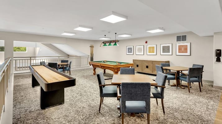 Game room featuring billiards and seating area.
