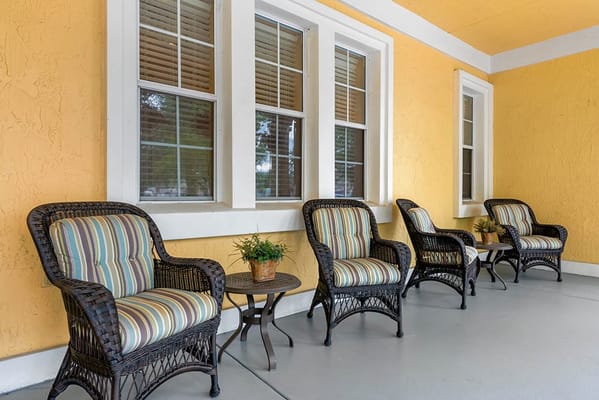 Outdoor seating area with chairs and potted plant