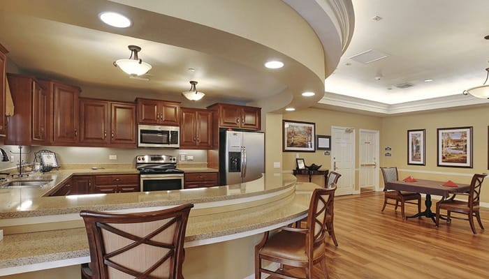 Interior view of a common area with kitchen and seating