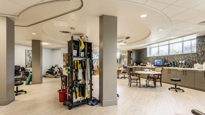 Interior view of a therapy area with equipment and seating