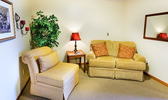 Cozy seating area in a senior living facility room