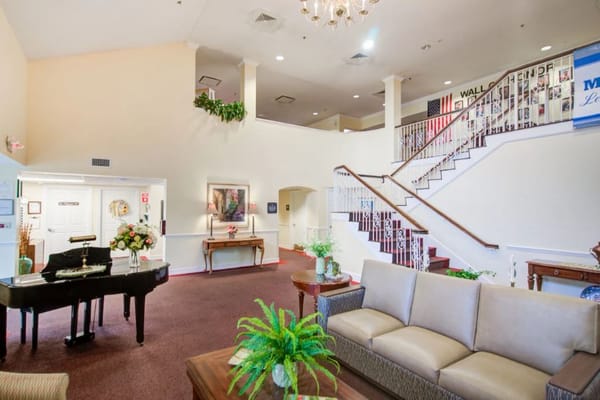 Spacious lobby with piano and seating area