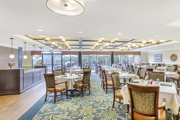 Bright dining room with tables and chairs
