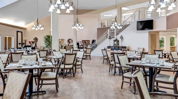 Spacious dining area with tables set for meals
