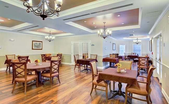 Bright dining room with tables set for dining