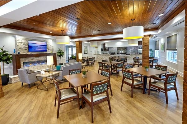 Bright dining area with tables and chairs
