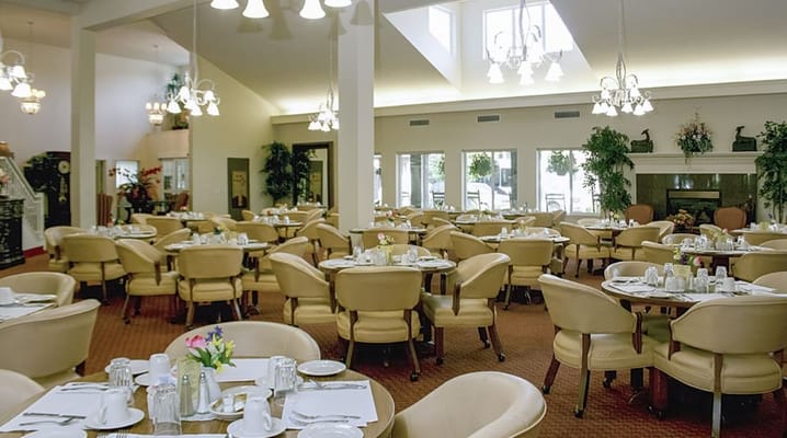 Dining room with tables set for meal service