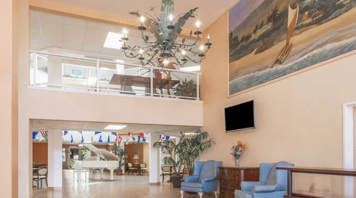 Common area with a chandelier and seating