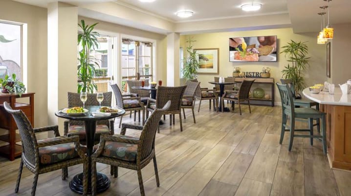 Interior dining area with tables and plants