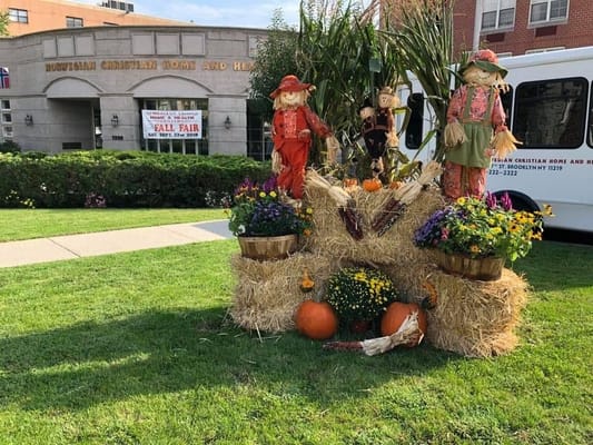 Outdoor fall decorations with building in the background