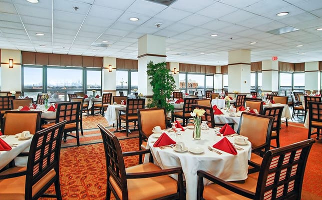 Elegant dining area with tables set for residents