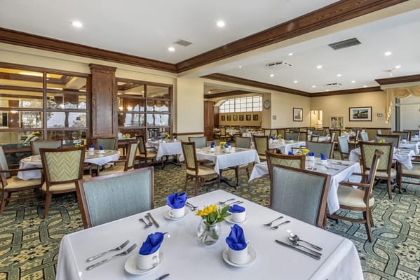 Dining area with tables set for residents