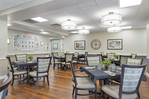 Dining room setup with tables and chairs