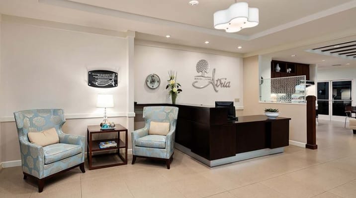 Reception area with chairs and front desk.