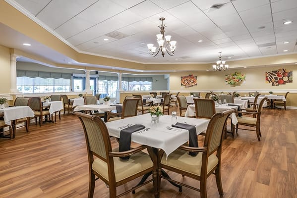 Elegant dining room setup with tables and chairs